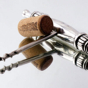 Picture of wine corkscrew on glass surface
